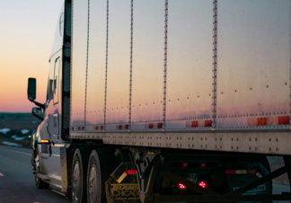 white freight truck on road during daytime